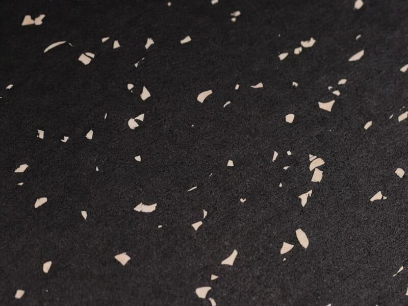 Cross-section view showing non-porous vulcanized rubber vs porous cold-pressed crumb rubber